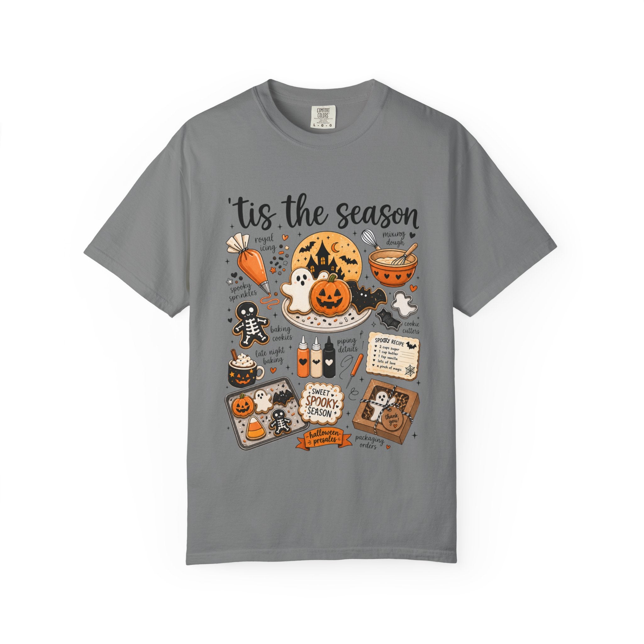 A gray short-sleeve crewneck t-shirt featuring a detailed Halloween-themed graphic print with illustrations of pumpkins, ghosts, a witch, and seasonal text, displayed on a clean white background.