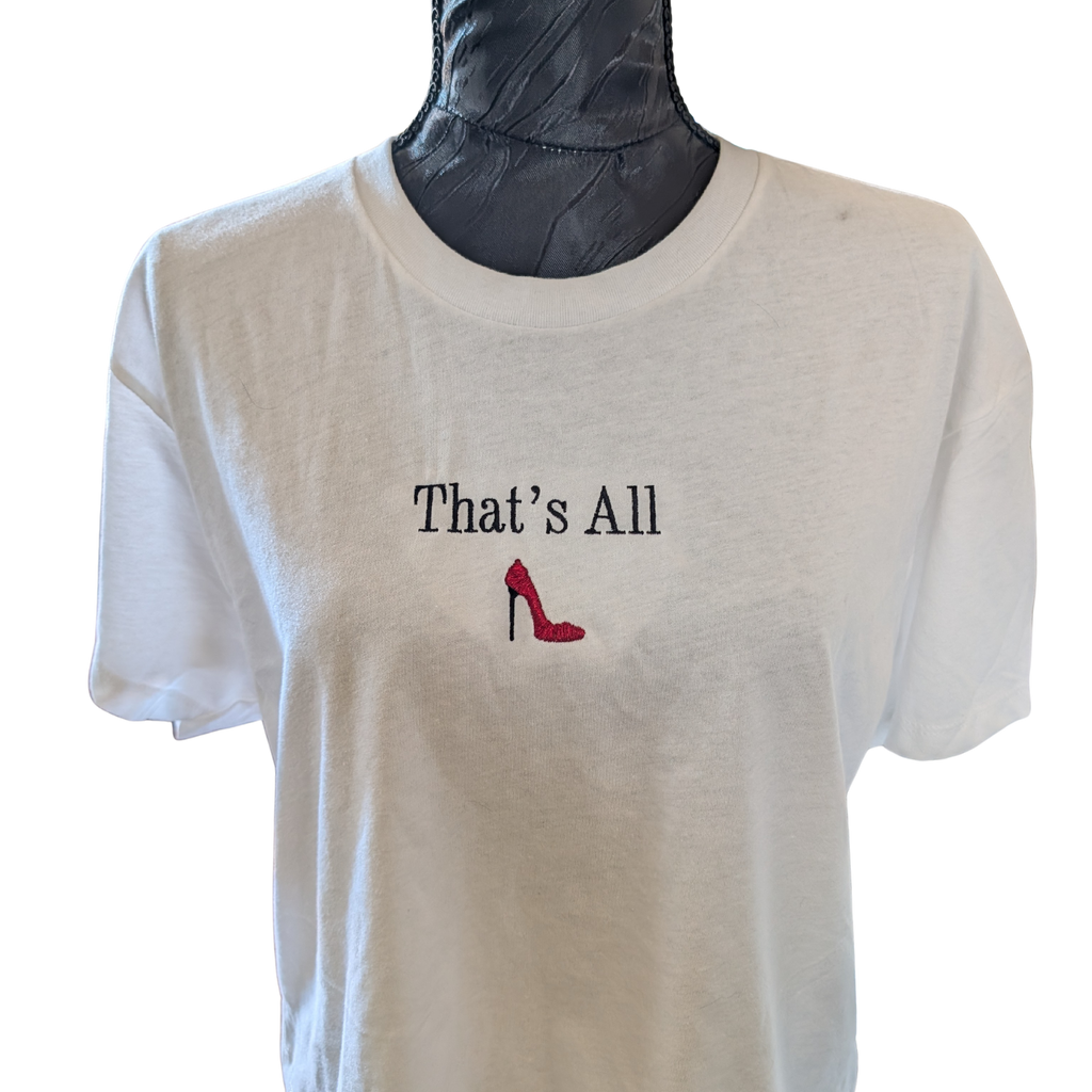 White t-shirt with 'That's All' and a red high heel shoe graphic on a mannequin.