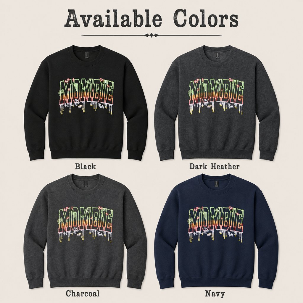 A color-options graphic titled 'Available Colors' showing four crewneck sweatshirts arranged in a 2x2 grid: Black, Dark Heather, Charcoal, and Navy. Each sweatshirt has a large dripping 'MOMBIE' graphic across the chest in multicolor tones.