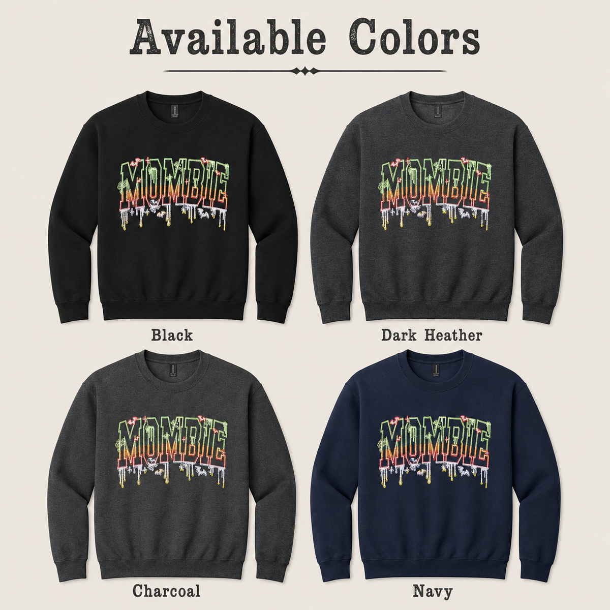 A color-options graphic titled 'Available Colors' showing four crewneck sweatshirts arranged in a 2x2 grid: Black, Dark Heather, Charcoal, and Navy. Each sweatshirt has a large dripping 'MOMBIE' graphic across the chest in multicolor tones.